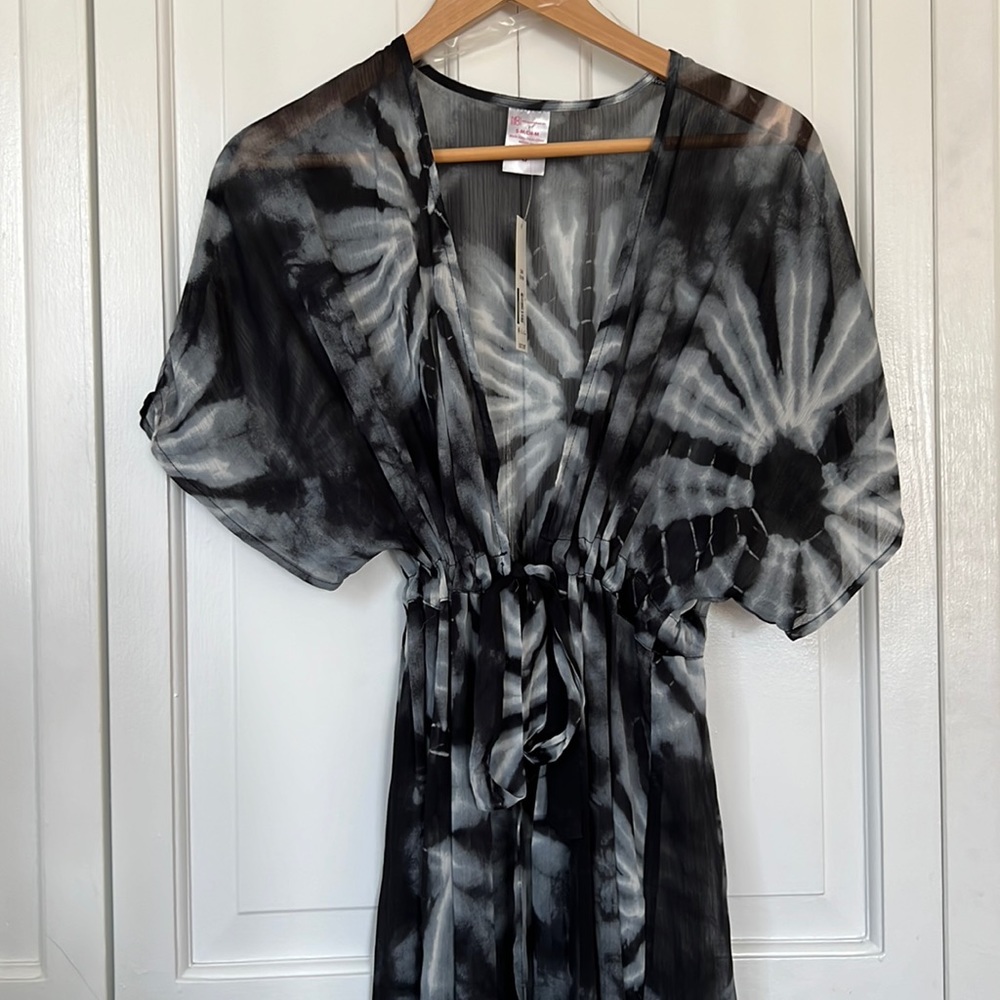 Sheer short sleeve tie dye print midi coverup. With adjustable self tie.